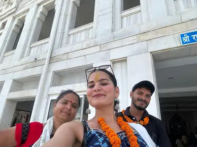 Guests wearing flower garlands outside their hotel in Mathura