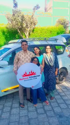 Family with Mathura Vrindavan Package board standing beside our car