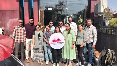 Group of travellers outside their hotel in Mathura