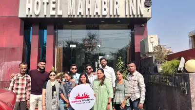 Family group outside Hotel Mahabir Inn in Mathura
