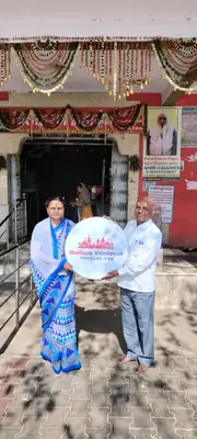 Pilgrims with a decorated temple entrance in Vrindavan